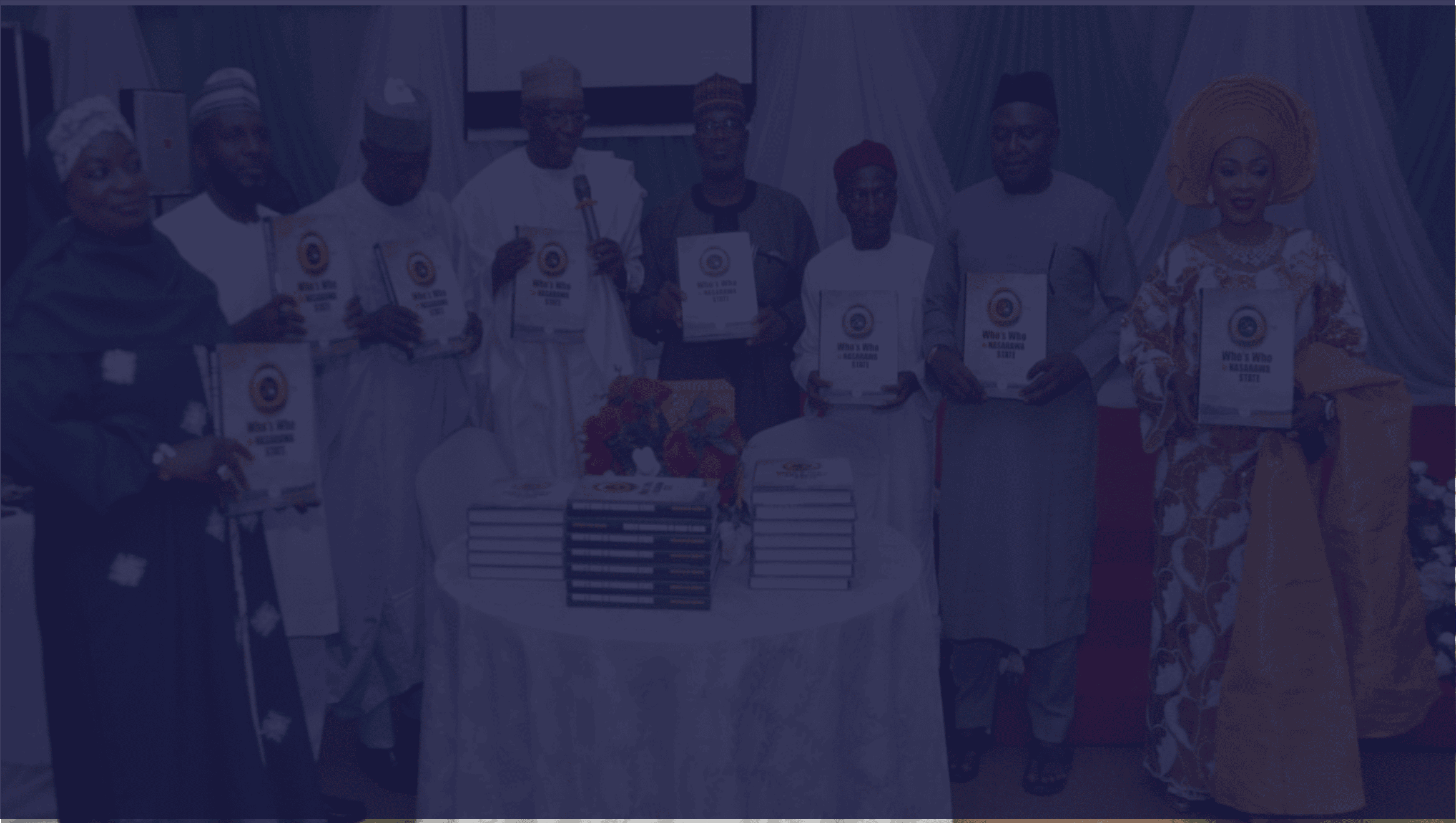 Recognize people in Nigeria Hall of Fame event holding awards and books for motivational leadership recognition.